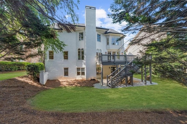 745 Glengate Pl, Atlanta, GA 30328 - back of property with stairs, a lawn, a chimney, a wooden deck, and stucco siding