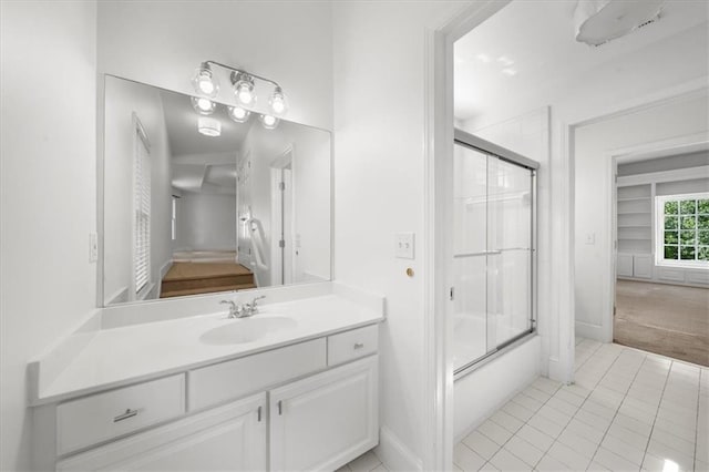 745 Glengate Pl, Atlanta, GA 30328 - bathroom featuring vanity, tile patterned floors, and combined bath / shower with glass door