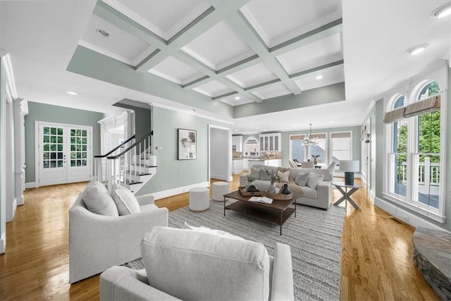 745 Glengate Pl, Atlanta, GA 30328 - living area featuring stairway, wood finished floors, coffered ceiling, a chandelier, and beamed ceiling