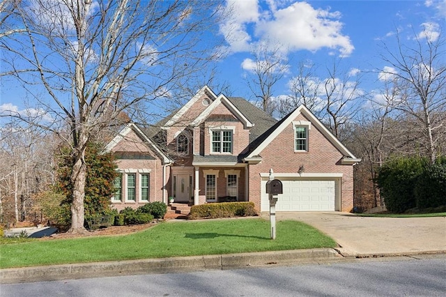 view of front of property with a garage and a front lawn