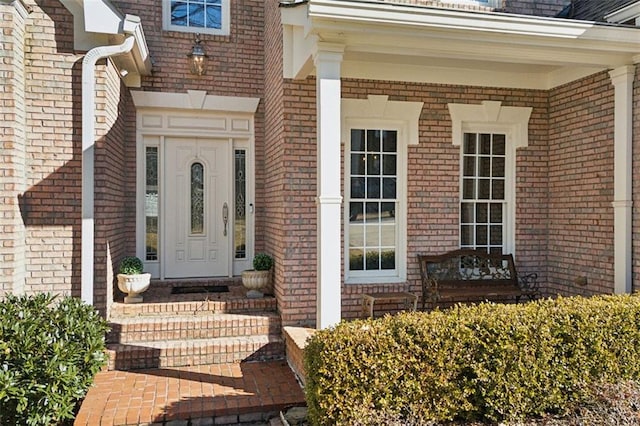 view of exterior entry featuring a porch