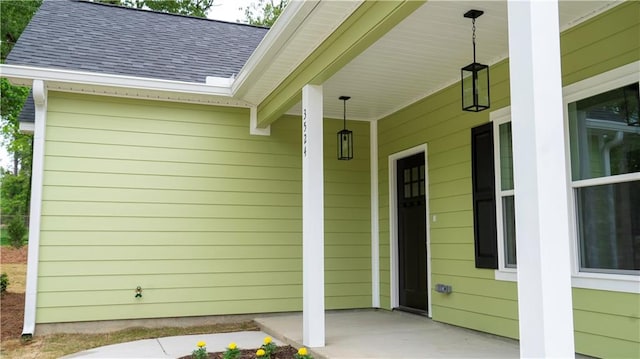 property entrance featuring a porch