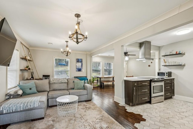 living room featuring light hardwood / wood-style flooring, crown molding, plenty of natural light, and ceiling fan with notable chandelier