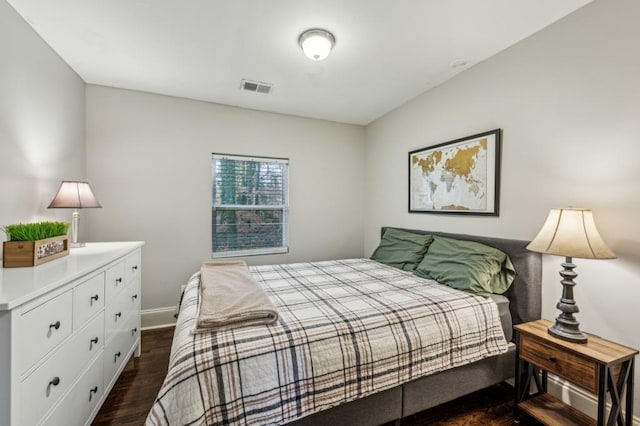 bedroom featuring dark wood-type flooring