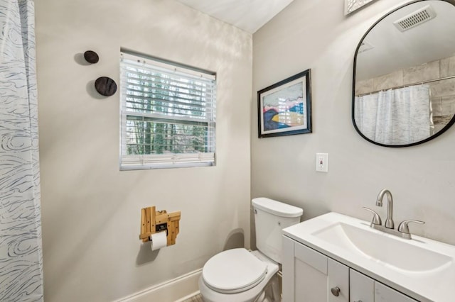 bathroom with vanity, toilet, and a shower with shower curtain