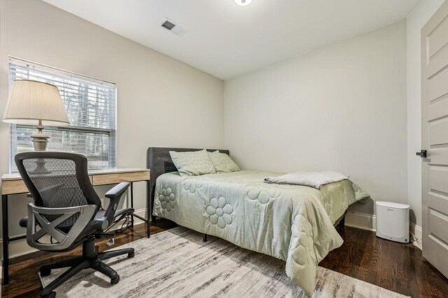 bedroom featuring hardwood / wood-style floors