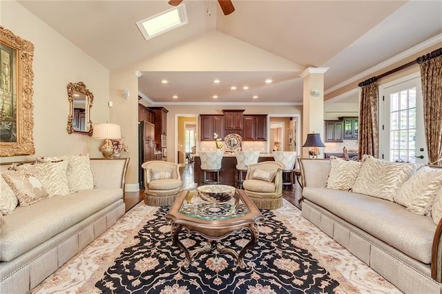 living area featuring lofted ceiling, recessed lighting, wood finished floors, a ceiling fan, and crown molding