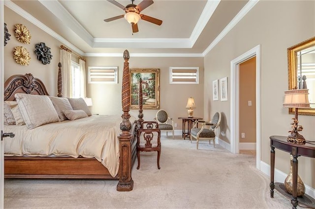 bedroom featuring light carpet, multiple windows, ornamental molding, and a raised ceiling