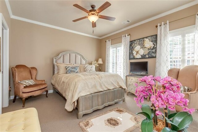 bedroom featuring baseboards, visible vents, ceiling fan, carpet, and crown molding