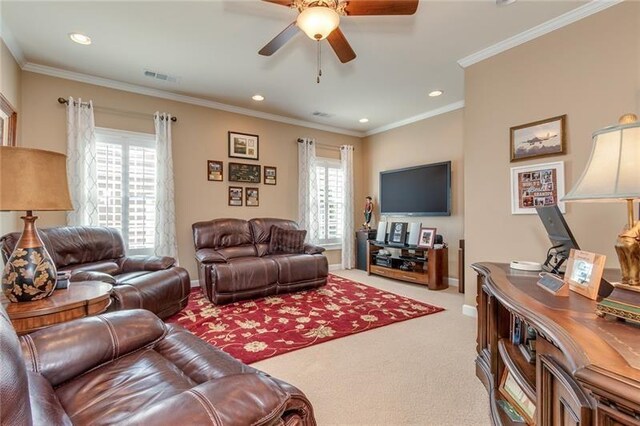 living area with recessed lighting, a ceiling fan, visible vents, carpet, and crown molding