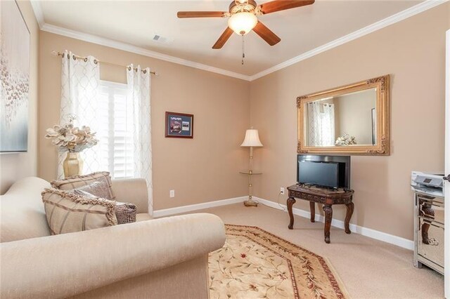 interior space featuring ornamental molding, ceiling fan, and baseboards