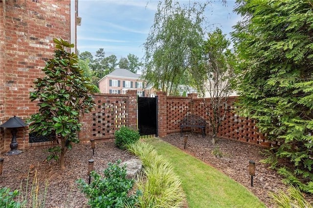 view of yard with a gate and fence