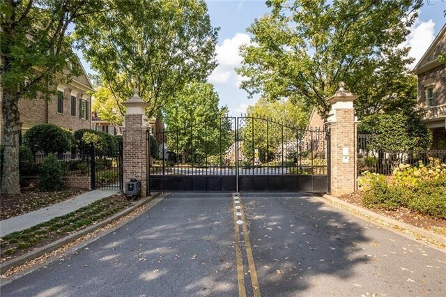 view of gate with fence