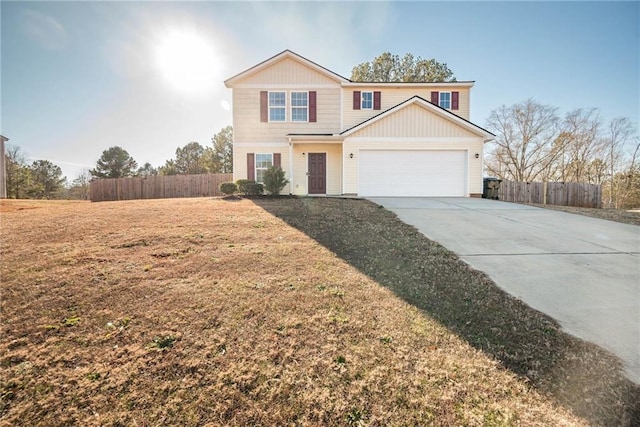 view of front of property with a front lawn and a garage