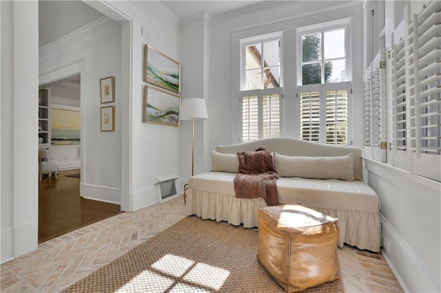 sitting room featuring crown molding