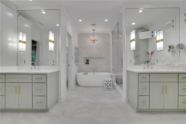 full bathroom featuring vanity, separate shower and tub, a notable chandelier, and toilet