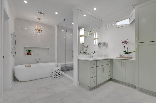 bathroom featuring a notable chandelier, shower with separate bathtub, vanity, and crown molding