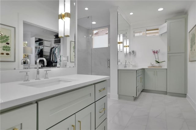 bathroom with vanity and a shower with shower door