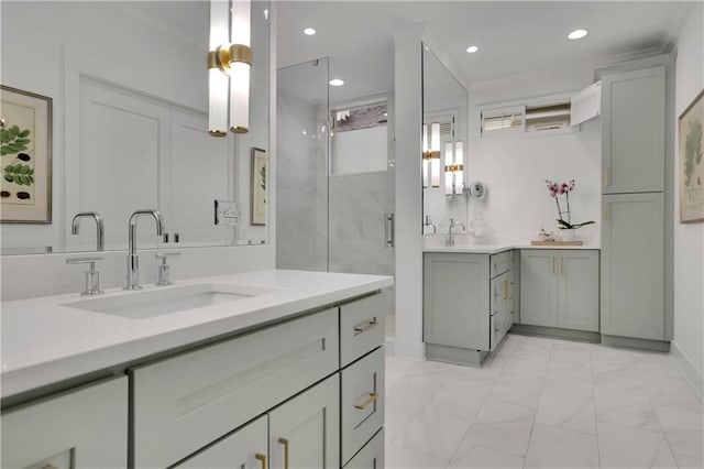 bathroom with vanity, crown molding, and a shower with door