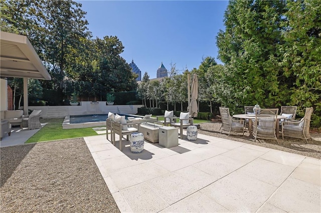 view of patio featuring a fenced in pool