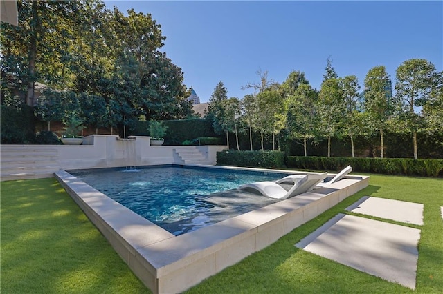 view of pool featuring a yard and a patio area