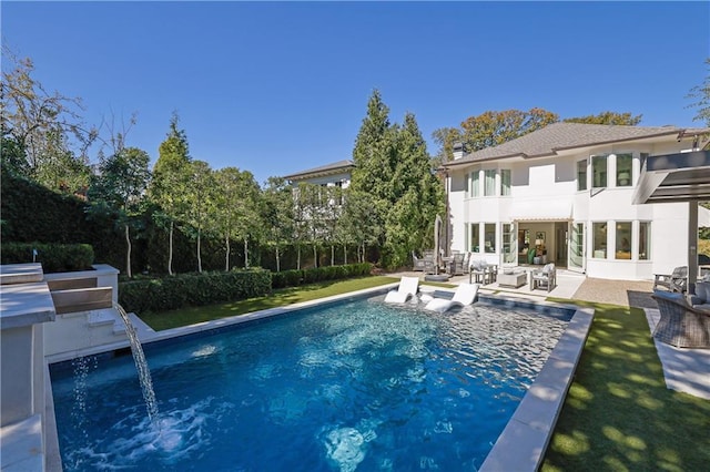 rear view of property with a patio area