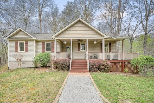 view of front of house with ceiling fan, a front lawn, covered porch, and crawl space