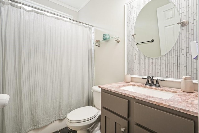 full bath featuring vanity, ornamental molding, and toilet