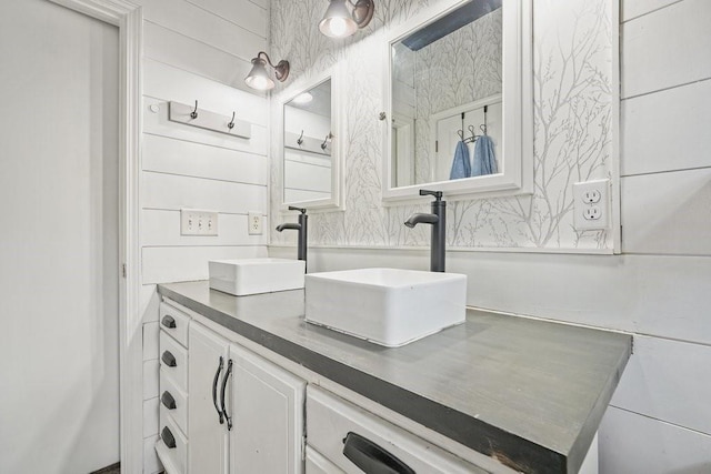 bathroom featuring double vanity and a sink