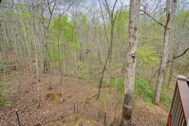 view of landscape with a forest view