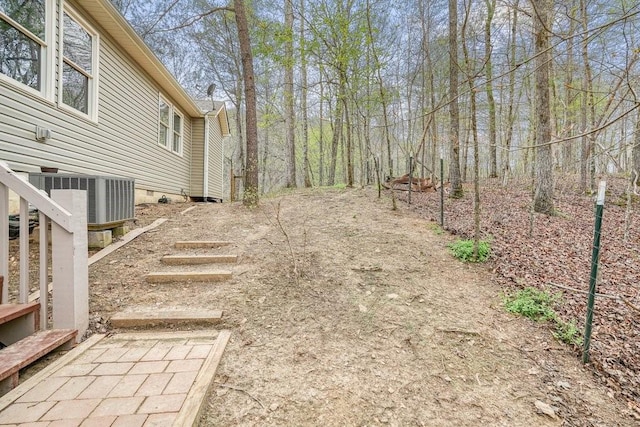 view of yard featuring central air condition unit