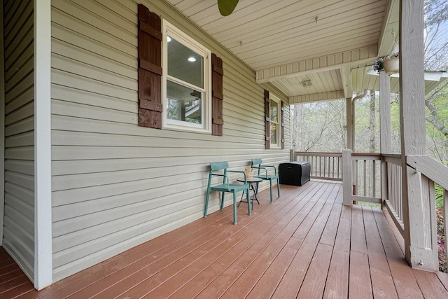 wooden terrace featuring covered porch