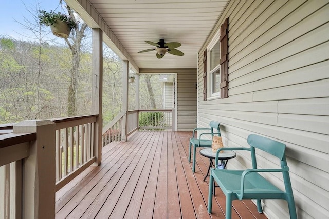 wooden terrace featuring ceiling fan