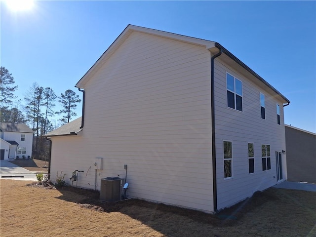 view of home's exterior with central AC