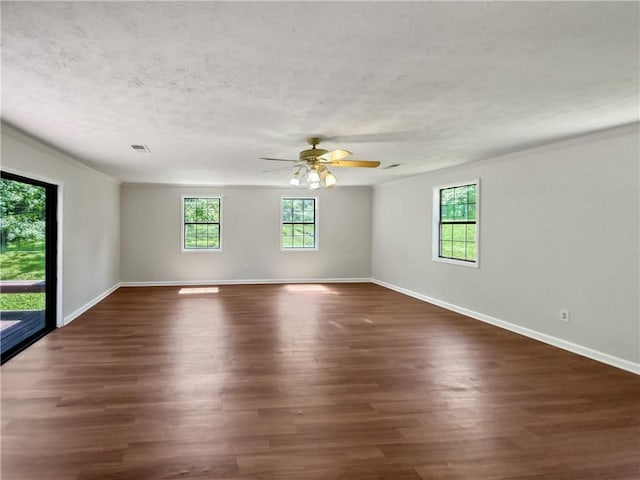 empty room featuring ceiling fan and dark hardwood / wood-style flooring