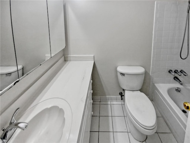 full bathroom featuring toilet, vanity, tile patterned floors, and tiled shower / bath