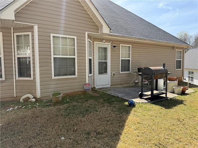 4206 Shoreside Cir, Snellville, GA 30039 - rear view of house featuring a yard, a patio area, and a shingled roof