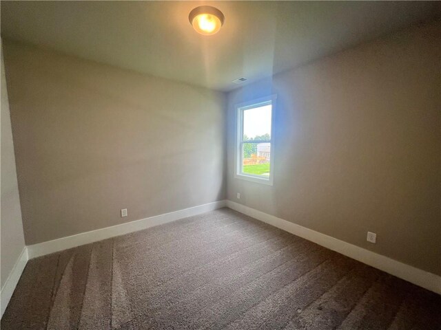 unfurnished room with carpet floors