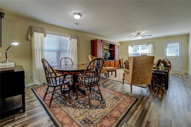 110 Baltusrol Way, Covington, GA 30014 - dining space featuring wood finished floors, a ceiling fan, and baseboards