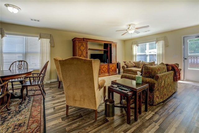 110 Baltusrol Way, Covington, GA 30014 - living area featuring dark wood-type flooring, ceiling fan, and baseboards