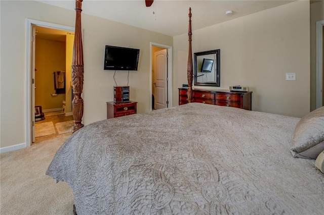 110 Baltusrol Way, Covington, GA 30014 - carpeted bedroom featuring baseboards, a ceiling fan, and connected bathroom