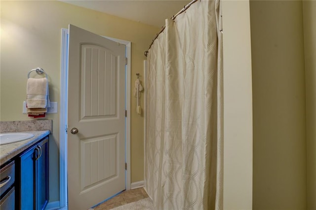 110 Baltusrol Way, Covington, GA 30014 - bathroom with vanity, curtained shower, and tile patterned floors