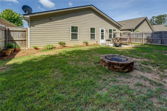 110 Baltusrol Way, Covington, GA 30014 - back of property with a fire pit and a patio