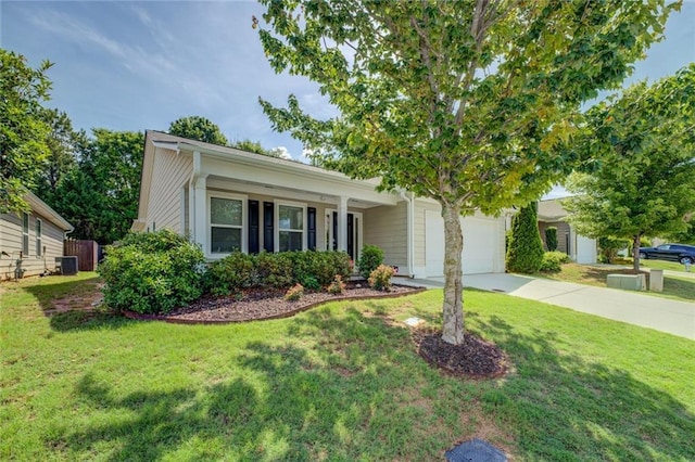 110 Baltusrol Way, Covington, GA 30014 - view of front of house with driveway, central AC, a front lawn, and an attached garage