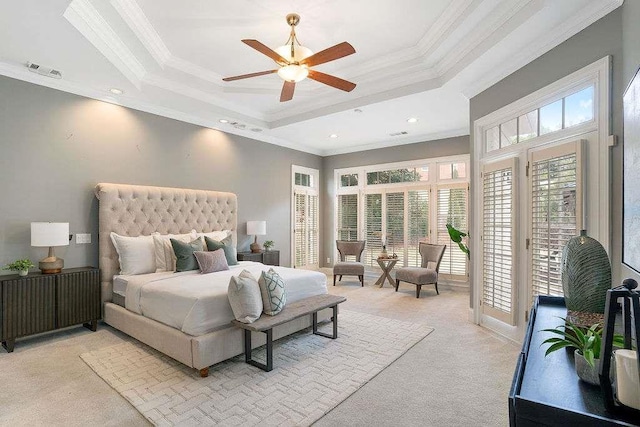 carpeted bedroom featuring ceiling fan, crown molding, access to outside, and a tray ceiling