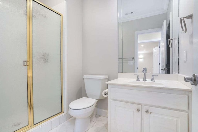 bathroom with tile patterned floors, toilet, a shower with door, vanity, and ornamental molding