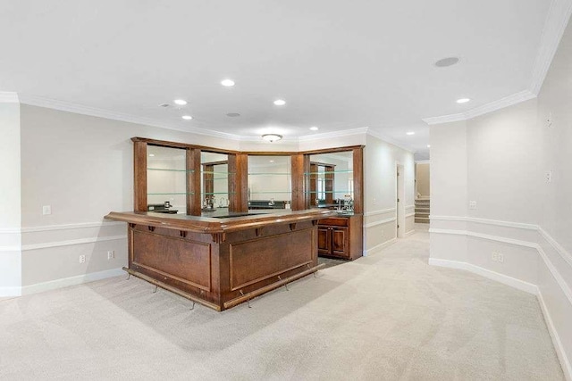 kitchen featuring ornamental molding and light carpet