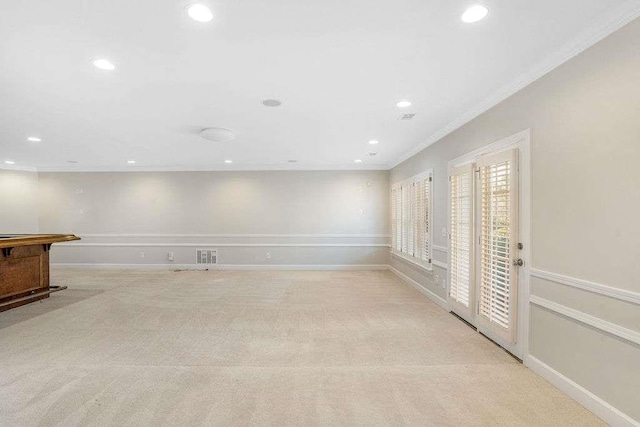 empty room with light carpet and ornamental molding