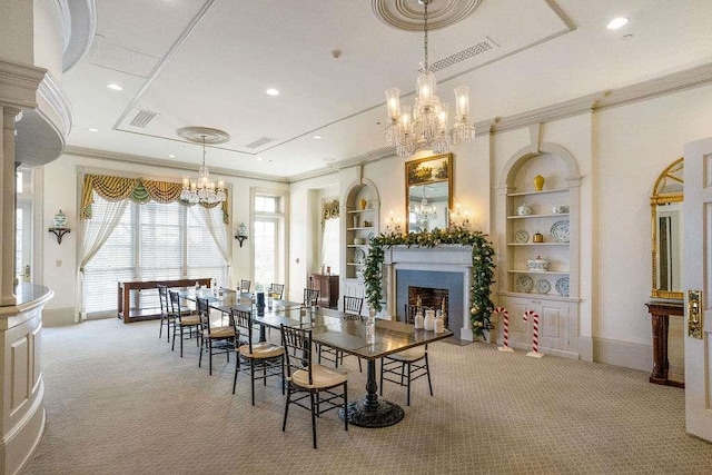 dining room featuring built in shelves, light colored carpet, and crown molding