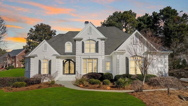 view of front of house with a lawn